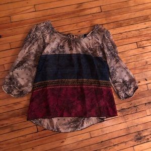 Cream, blue, red blouse